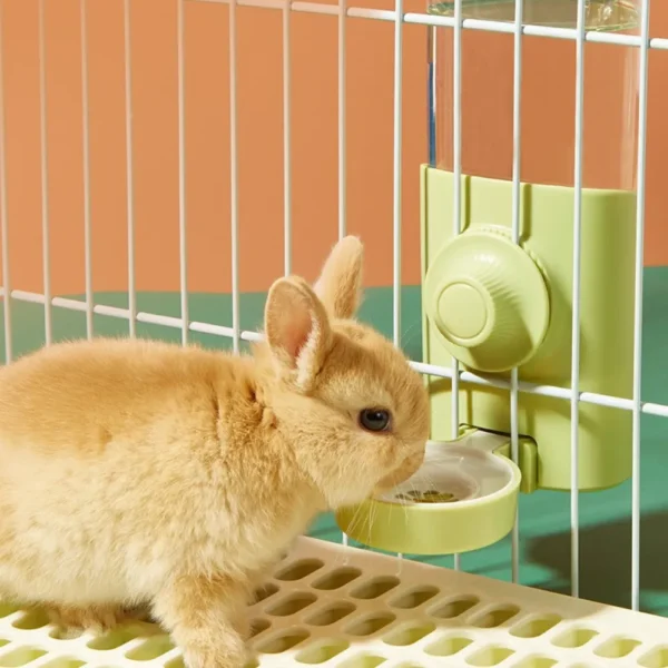 10003 Demonstration of hanging water bottle showing no-drip round head and secure cage attachment