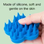 10007 Flower-shaped silicone pet brush in cyan blue for gentle grooming and bathing