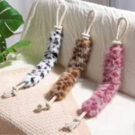 10008 Dog playing with plush rope chew toy – wholesale interactive pet supplies for retailers