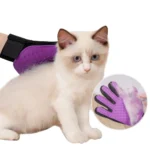 Cat enjoying grooming session with deshedding pet glove