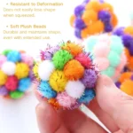 Close-up of glitter texture and bell inside colorful cat toy ball