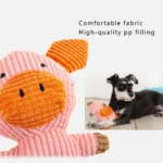 Small dog playing with pink pig plush chew toy in home setting
