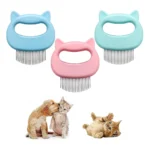 Ergonomic shell-shaped cat grooming comb with needle design for pet hair brushing – available in pink, blue, light green