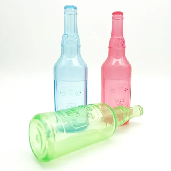 10002 Dog playing with rubber squeaky bottle chew toy indoors