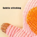 Close-up of pink pig plush dog toy with corduroy texture for chewing