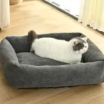 Medium dog resting in grey wholesale pet bed with soft fabric and anti-slip bottom
