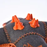 10004 Close-up of chew cube dog toy with reinforced stitching and squeaky design for durability.