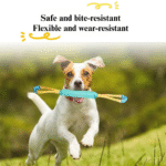 Dog playing tug-of-war with interactive rope toy outdoors