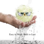 10006 Dog playing with colorful squeaky plush ball indoors