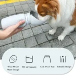 10008 Dog drinking from portable outdoor travel water bottle during walk