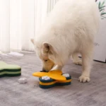 10005 Dog playing with interactive puzzle feeder toy for mental stimulation and slow feeding