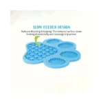 Pet owner applying peanut butter on silicone lick mat with suction base sticking to wall or floor for calming bath sessions