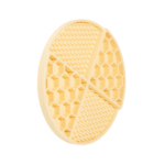 Yellow silicone dog licking mat with textured surface