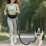 woman running with dog using hands free waist belt dog leash outdoors